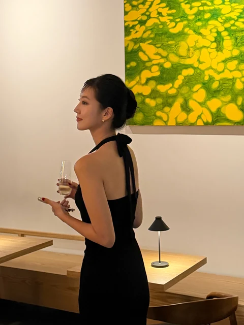 Yeaji in a black dress at an opening in Manhattan
