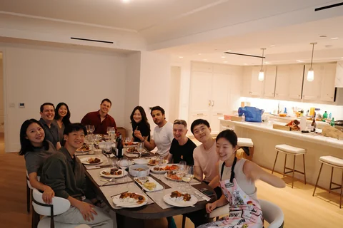 Friends gathered around a dining table for Chuseok in Manhattan
